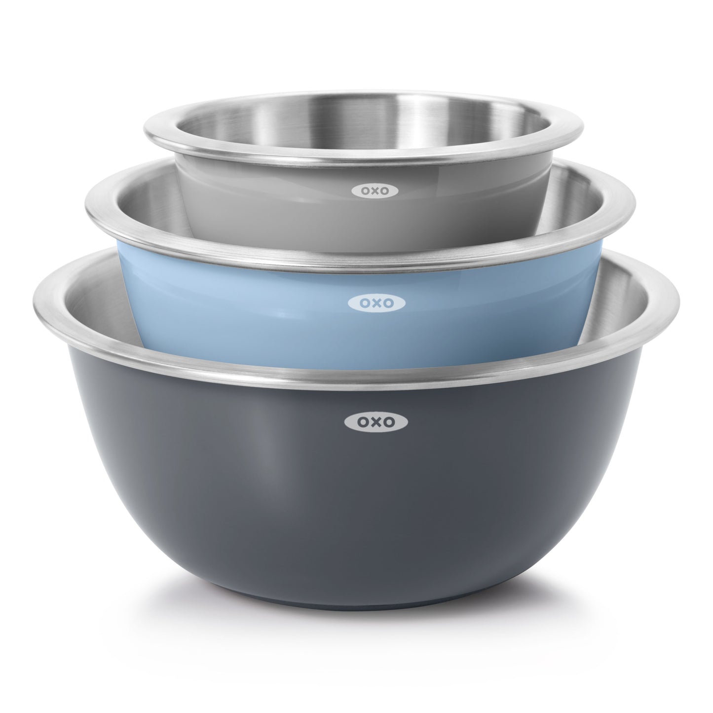 Set of three OXO stainless steel mixing bowls in gray, blue, and black on a white background