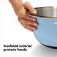 Hand holding blue mixinb bowl showing an insulated exterior. 