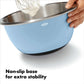Hand using blue insulated mixing bowl showing a non slip base. 