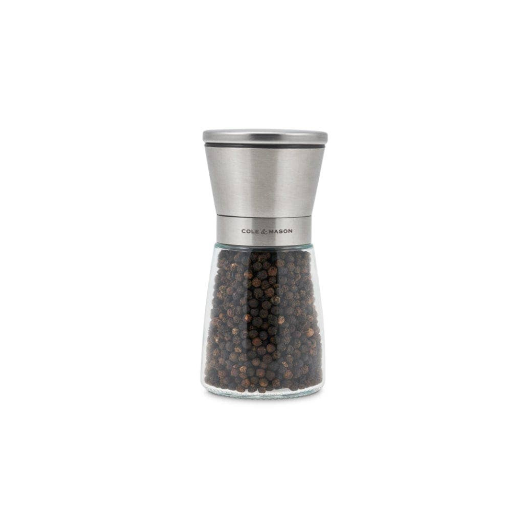 A modern and elegant salt and pepper mill set designed for a clean, mess-free kitchen. With the grinding mechanism positioned at the top, your countertops, cupboards, and dining table stay free of spills.