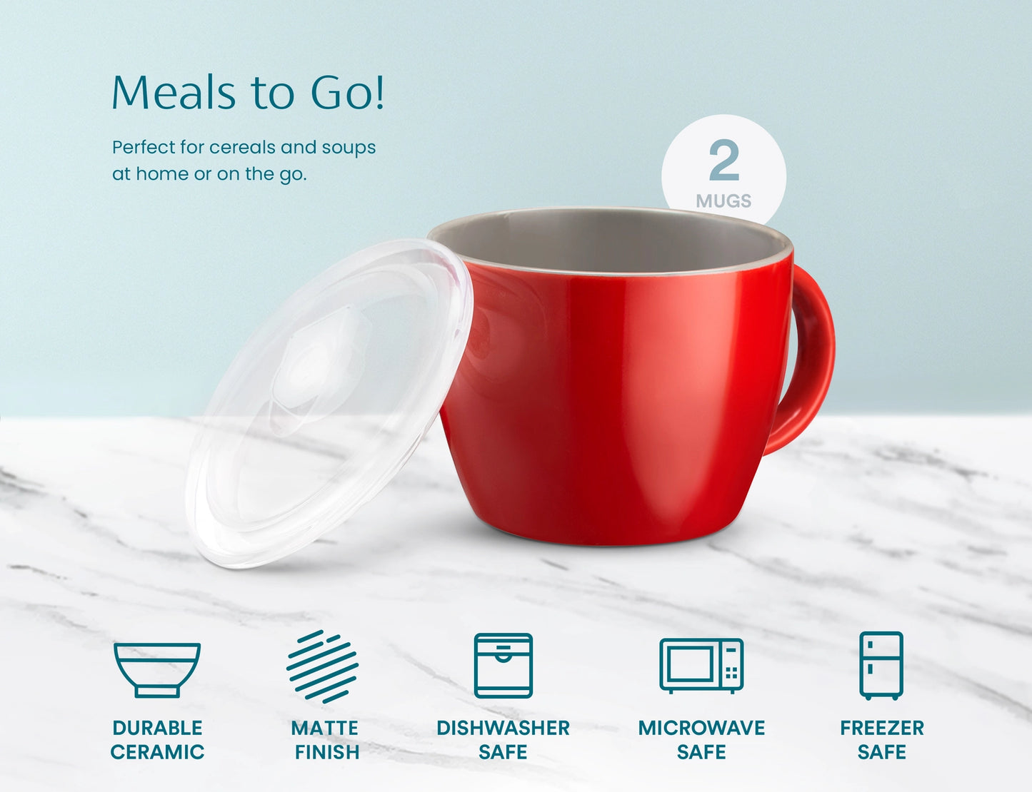A red ceramic mug with a clear lid, shown on a light marble surface against a pale blue background. Text reads 'Meals to Go!' and '2 MUGS,' with feature icons below for durable ceramic, matte finish, dishwasher safe, microwave safe, and freezer safe.