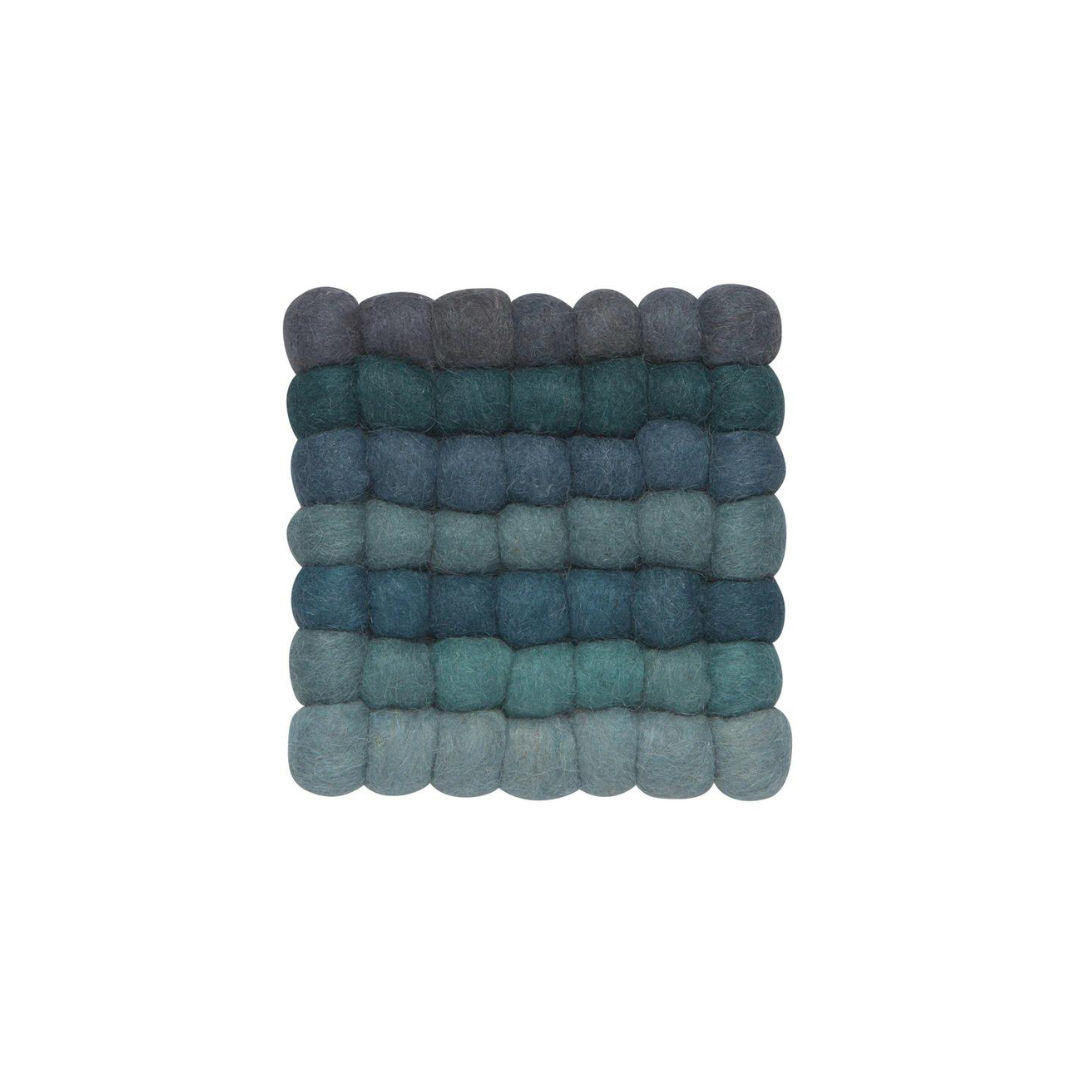 Add a splash of color and texture to your kitchen with the Trivet - Wool Felt Dots in Lagoon!