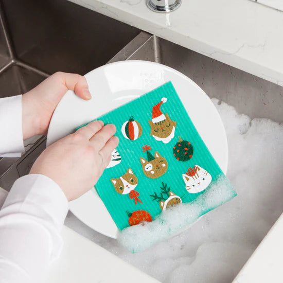 Let the charm of a playful clowder of cats spice up your cleaning routine with the Let it Meow Swedish Sponge Cloth by Ecologie! 