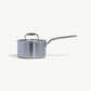 A stainless steel saucepan with a lid and a long handle, set against a white background.