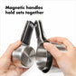 Hands holding a set of 4 silver magnetic measuring cups 
