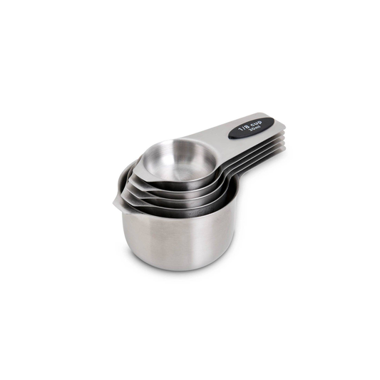 Set of stainless steel measuring cups on a white background