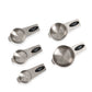 Set of five stainless steel measuring cups with black labels on a white background