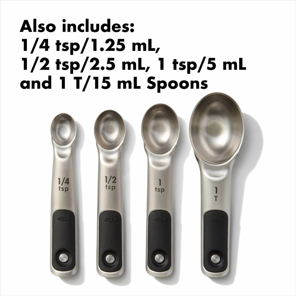 Set of four metal measuring spoons with measurments. 