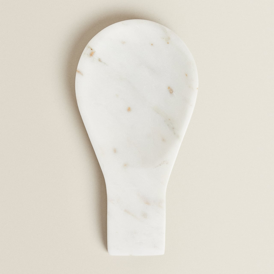 White marble spoon rest for any stovetop is a thing a beauty and function.  Holds all those utensils getting put to good use during cooking and acts a stylish centerpiece for your stove when not in use.