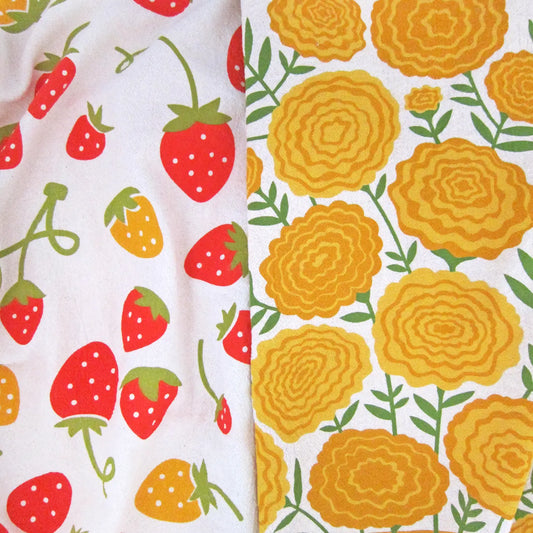 This dish towel gift sets are packaged up ready for gifting! The Mari Berry set contains 2 100% cotton, unbleached kitchen towels: Marigolds & Strawberries