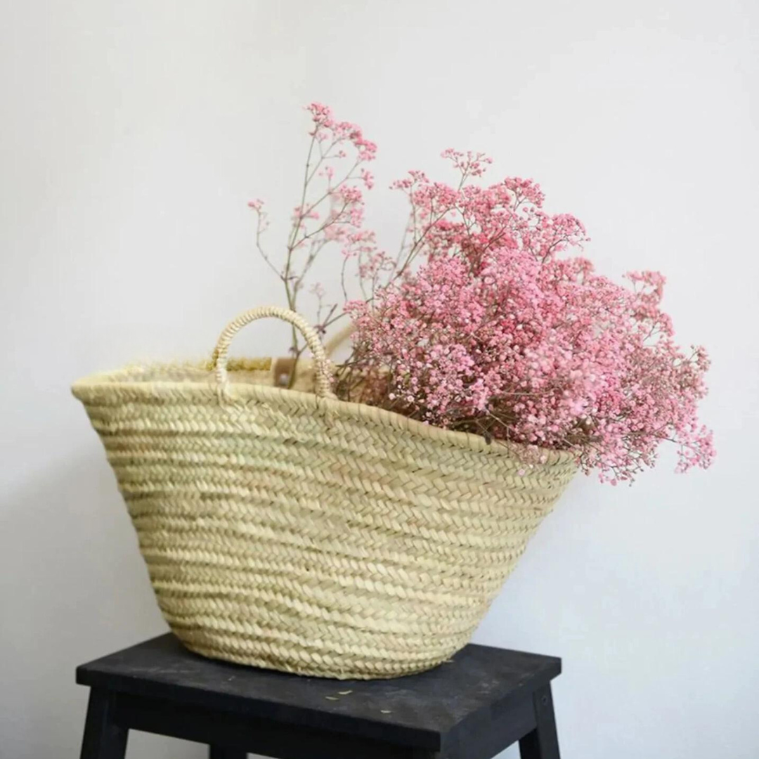  This small round wicker basket is perfect for any occasion—whether grocery shopping, 