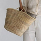  This small round wicker basket is perfect for any occasion—whether grocery shopping, 