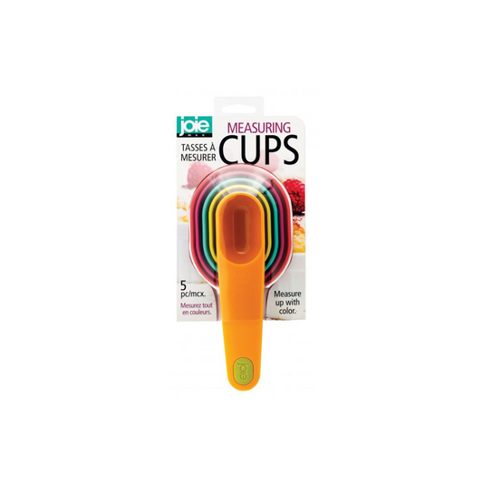 Set of colorful measuring cups stacked together in its packaging. 