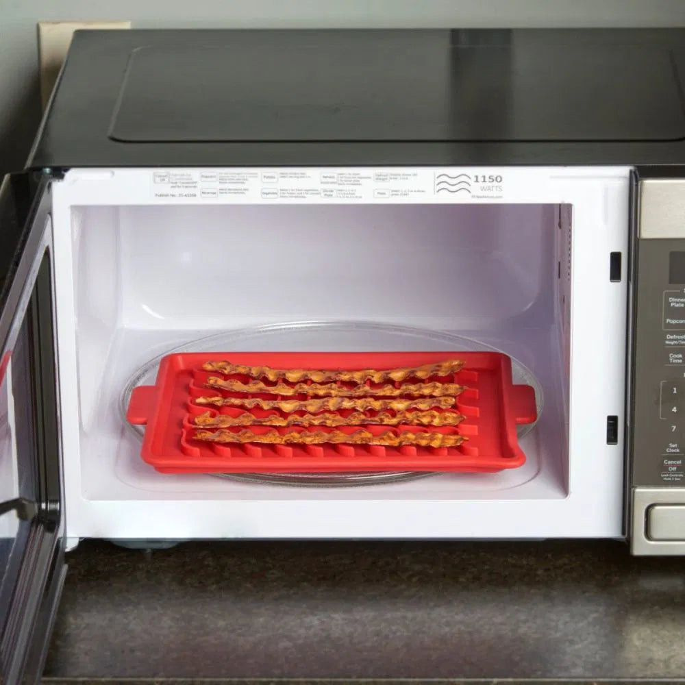 Red bacon cooking tray inside a microwave oven