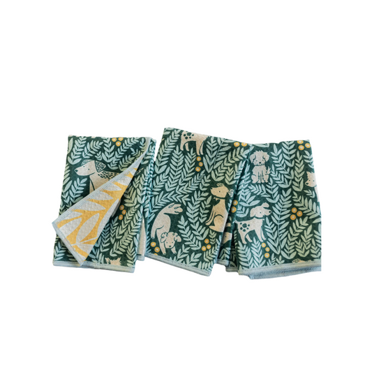 Calling all dog lovers! Our Mighty Mini Towel - Nuthatch Dog Park Set brings pure joy with playful pups on a lively teal backdrop and cheerful pops of yellow. The reversible design reveals a bold leaf pattern on sunny yellow, making these towels both fun and functional.