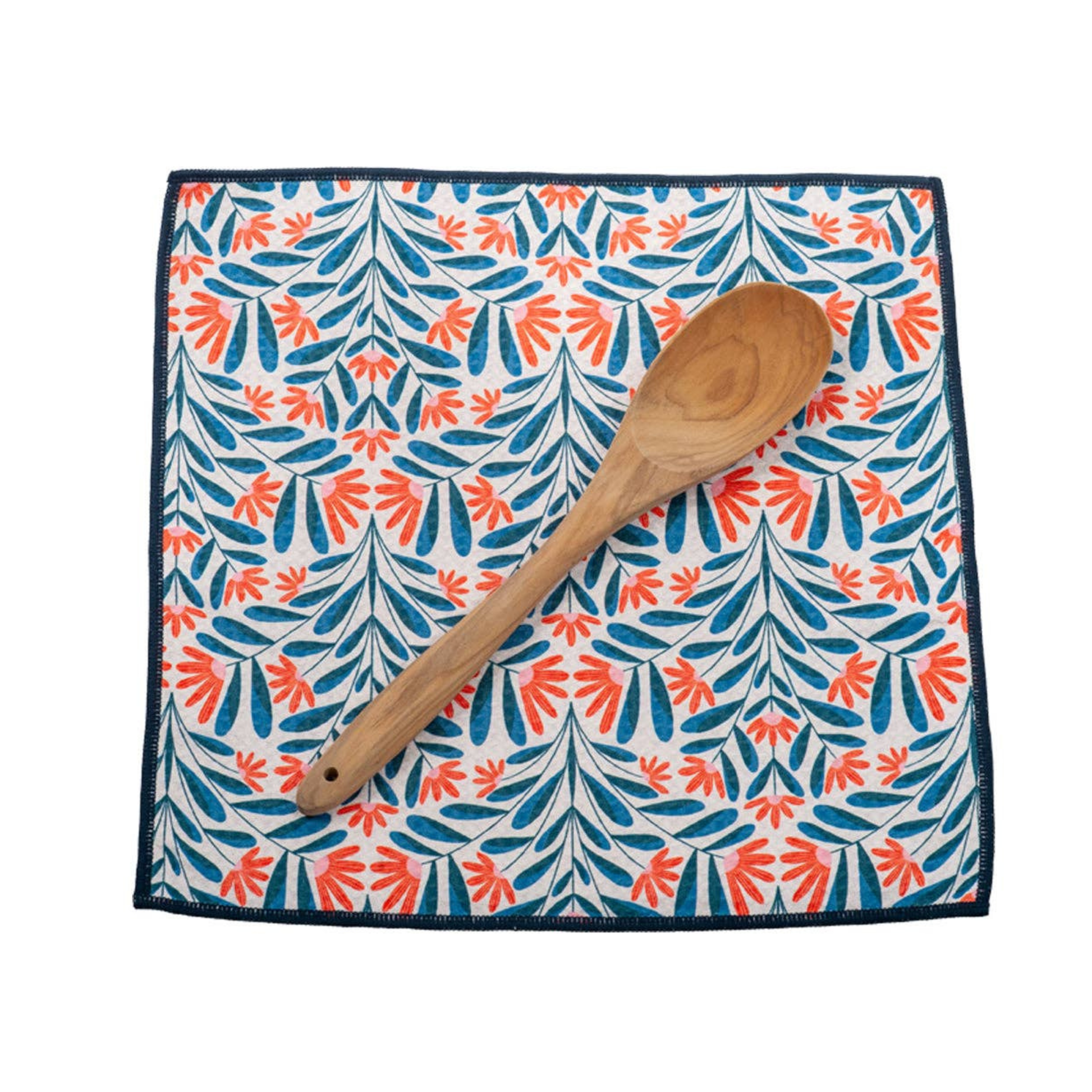 Patterned cloth with a wooden spoon on a white background