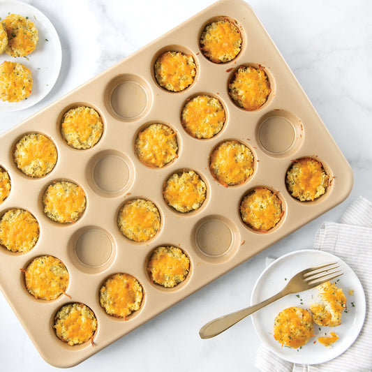 Baking professionals know that the secret to evenly baked and perfectly browned food is to cook with aluminum bakeware. This mini muffin pan, a necessity for any serious baker, is just the right size for snacks, kids' lunches, or brunch. Makes 24 individual mini treats. Proudly made in the USA. It's an easy way to make bite-size deliciousness that won't dry out. Whip up mini muffins, cupcakes, and more - you'll be a baking master in no time!