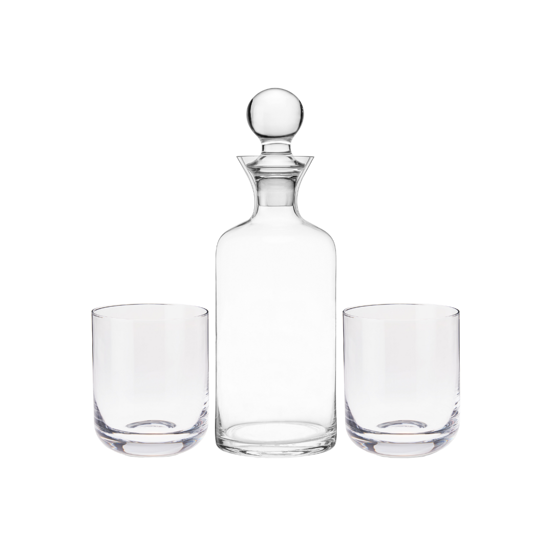 Hand-blown with pristine lead-free crystal, this gift set has superb weight and clarity— a perfect trio to elevate your favorite aged spirits. Includes the sleek decanter, rounded stopper, and two coordinating tumblers to serve and display your liquors at their best.  From graceful decanters to stylish coupes, Viski is dedicated to elegant design. Each collection explores a timeless bar style such as Art Deco or mid-century modern for a refined addition to your glassware collection.