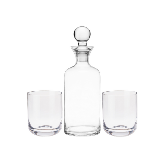 Hand-blown with pristine lead-free crystal, this gift set has superb weight and clarity— a perfect trio to elevate your favorite aged spirits. Includes the sleek decanter, rounded stopper, and two coordinating tumblers to serve and display your liquors at their best.  From graceful decanters to stylish coupes, Viski is dedicated to elegant design. Each collection explores a timeless bar style such as Art Deco or mid-century modern for a refined addition to your glassware collection.