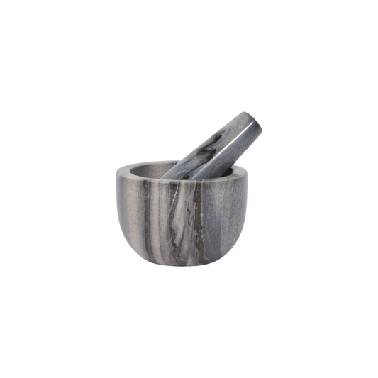 Elevate your kitchen with the timeless beauty and functionality of this Silver Clean Marble Mortar &amp; Pestle. Crafted from cool, sleek marble, each piece is unique, featuring natural variations in slate, white, pink, or onyx hues. The weight of the marble and the ergonomic fit of the pestle make grinding seeds, spices, and herbs effortless, while the non-porous surface ensures flavors remain pure and uncompromised.
