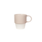 Two-tone beige and white mug on a white background