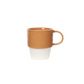 Ceramic mug with brown top and white bottom on a white background