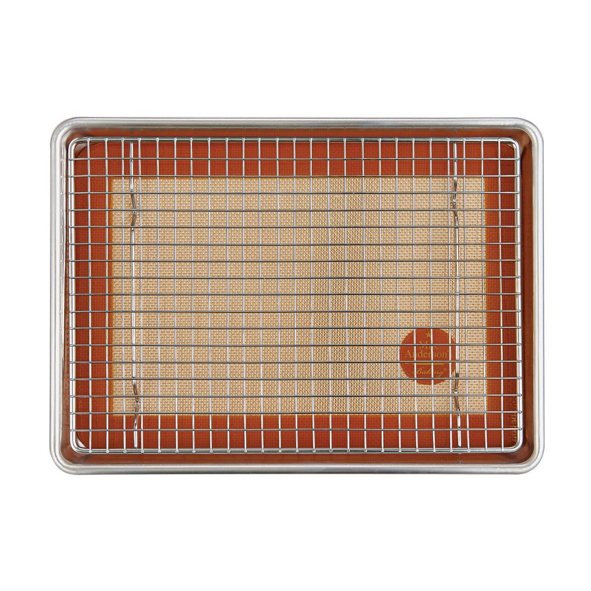 A rectangular metal baking pan with a wire cooling rack on top, set against a clean white background.