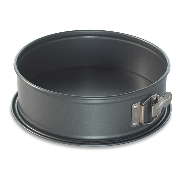 Metal springform pan on a white background