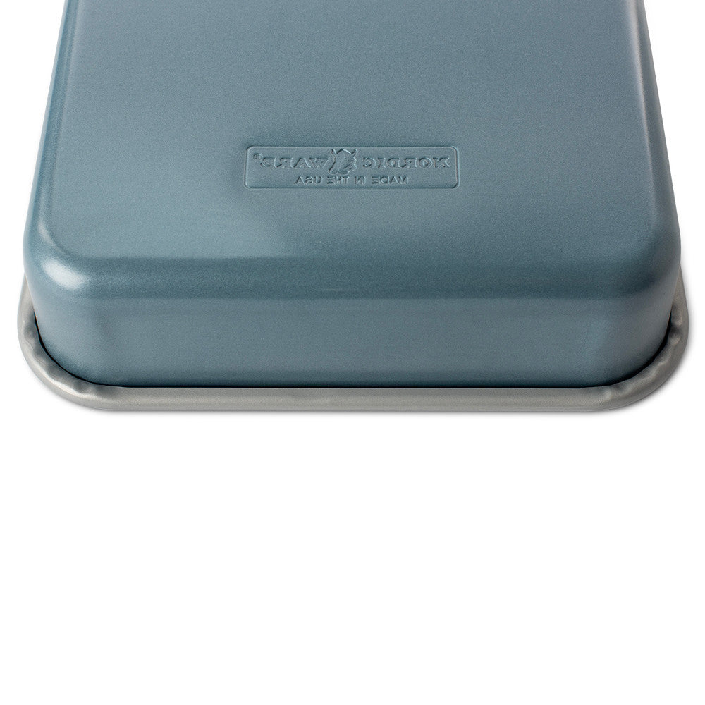 Blue metal lid with a brand logo on a white background