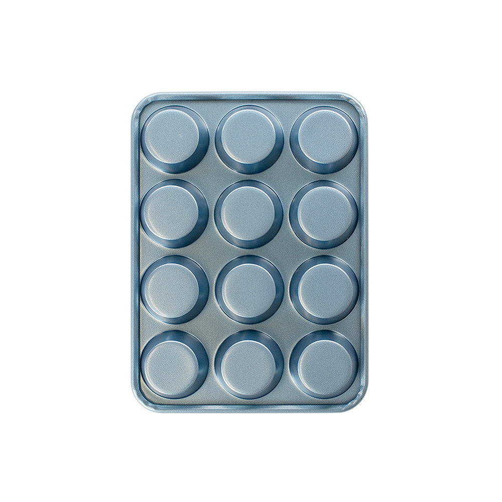 Metal muffin tin with 12 compartments on a white background