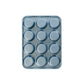 Metal muffin tin with 12 compartments on a white background