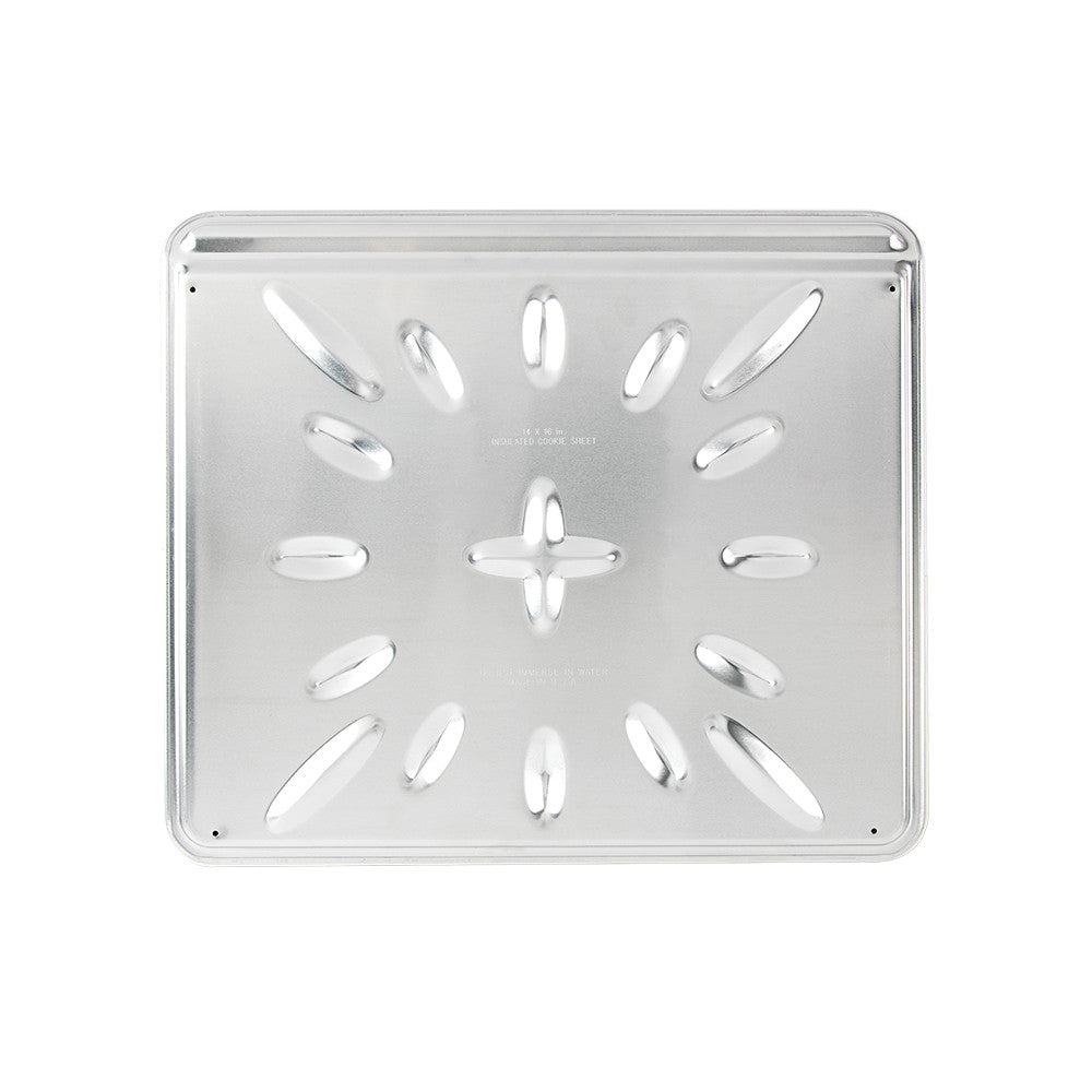 Metal baking tray with star and circle patterns on a white background