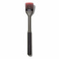 Barbecue brush with bristle head and black handle on a white background