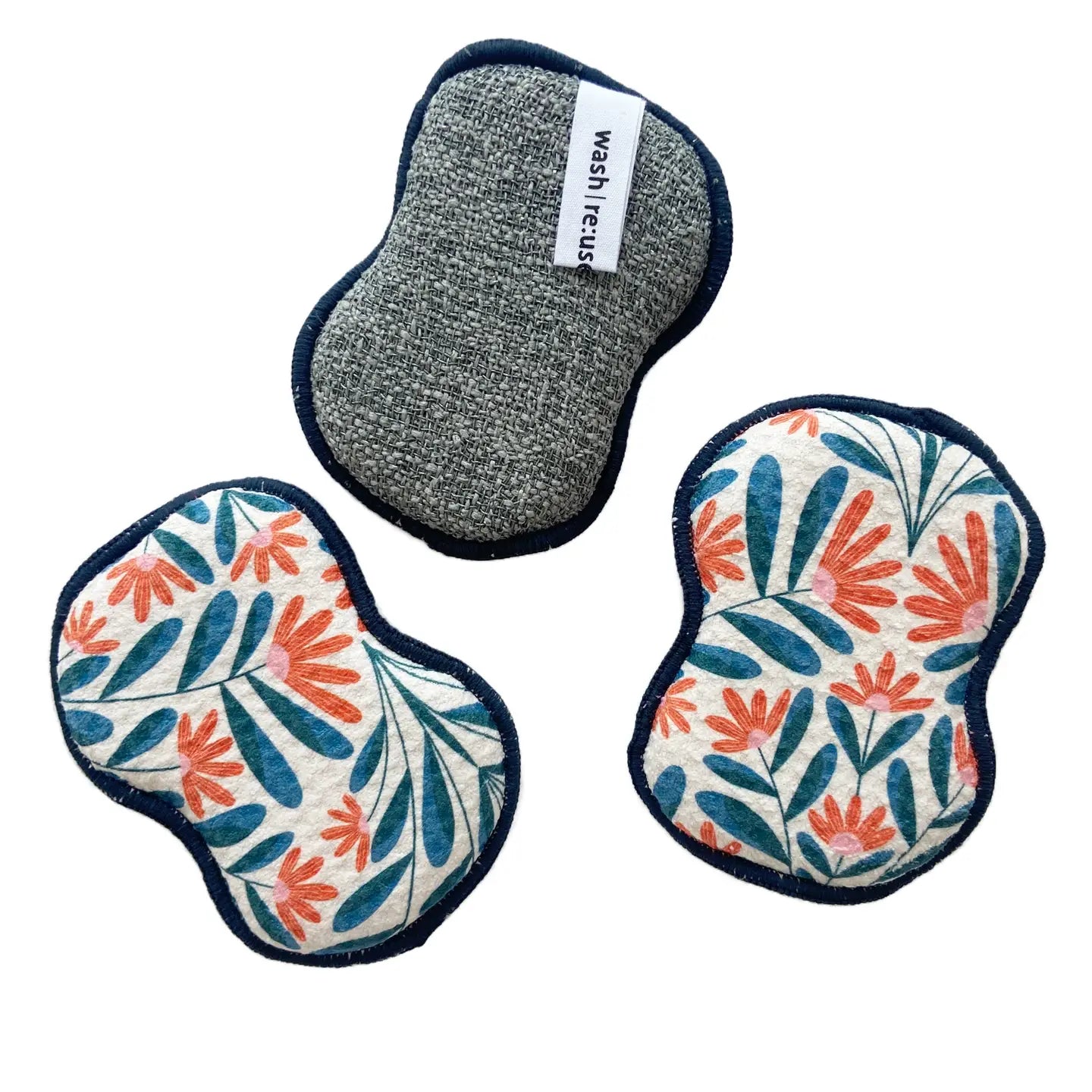 Three reusable pads with floral patterns on a white background