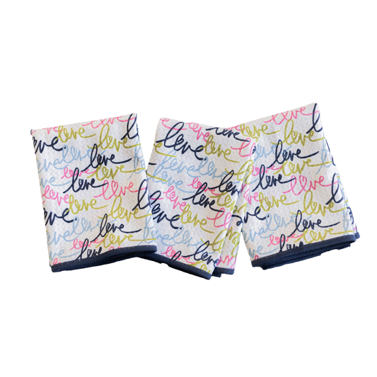 Pair of shorts with 'love' text in various colors on a white background