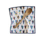 Colorful heart-patterned towel with a wooden spoon on a white background