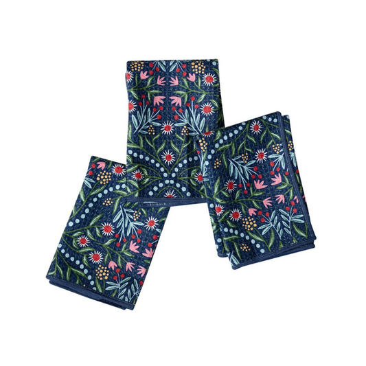 Set of three floral-patterned napkins on a white background