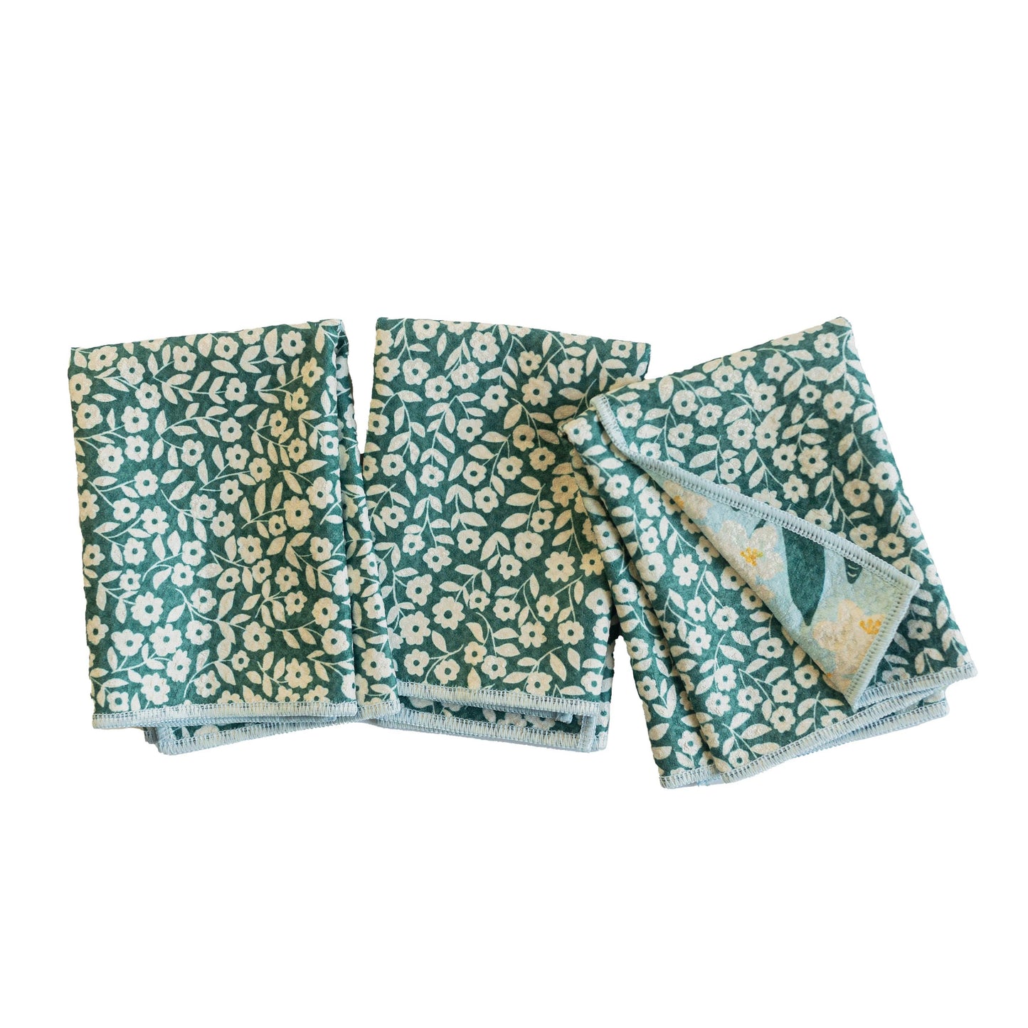 Set of three floral-patterned cloths on a white background