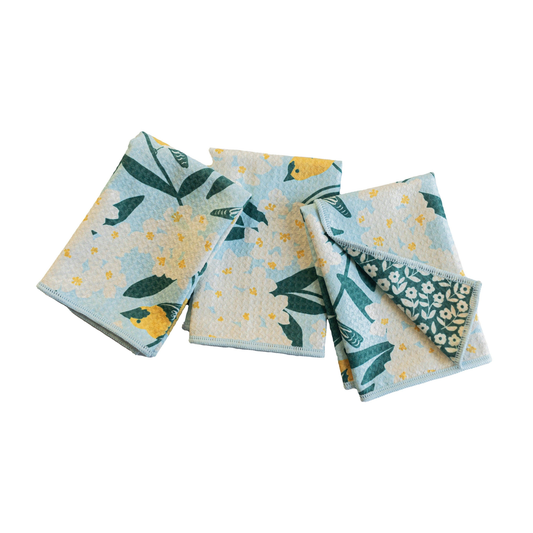 Set of three patterned cloths on a white background