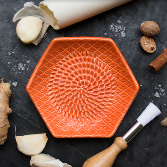 Orange grate plate set on counter