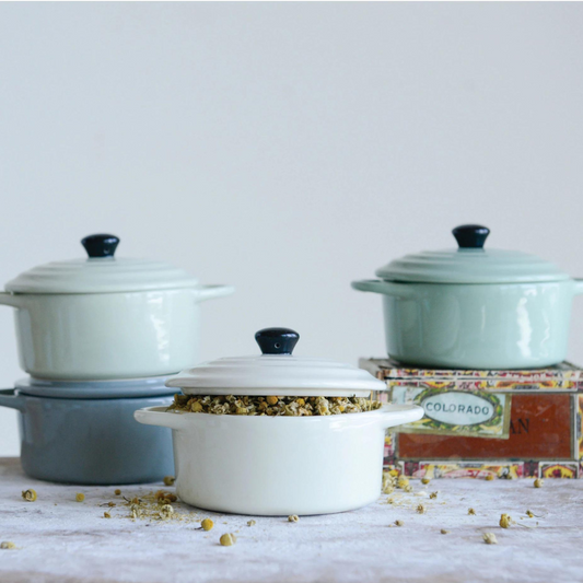 Creative Co-Op's Pale green mini Stoneware Baker with black handle.