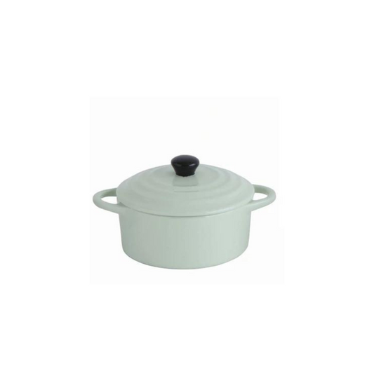 Creative Co-Op's Pale green mini Stoneware Baker with black handle.