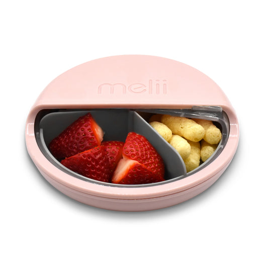 The Melii Spin Container is the ultimate snacking companion for active kids. With three compartments for food, this innovative snack container allows children to spin through their snacks, adding an element of excitement to snack time.  Designed with convenience in mind, the Melii Spin Container features a clear window that can be easily slid open, allowing children to select their desired snack with ease.
