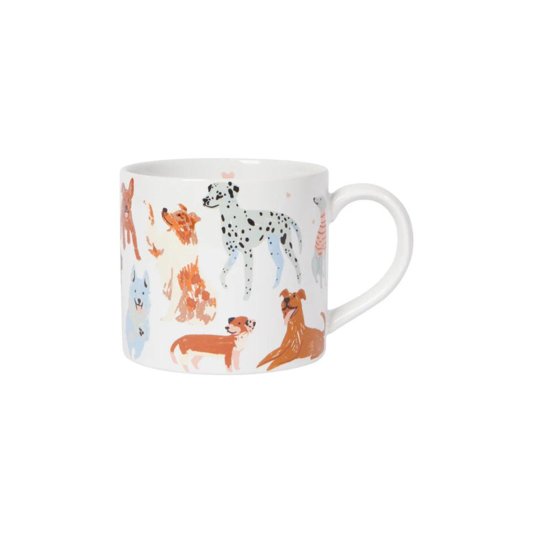 "Puppos" Mug in a Box! This mug is paws-itively adorable, featuring a playful pack of different dog breeds on the outside and a smooth white inside. 