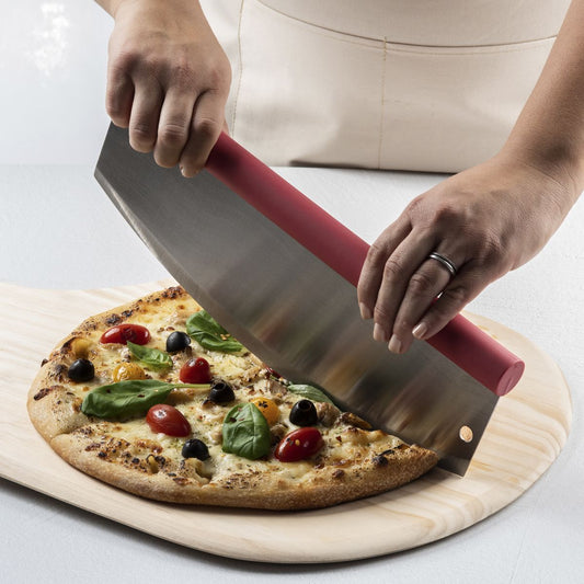 Rocking Pizza Cutter with Blade Guard being used to cut a pizza on a cutting board. 