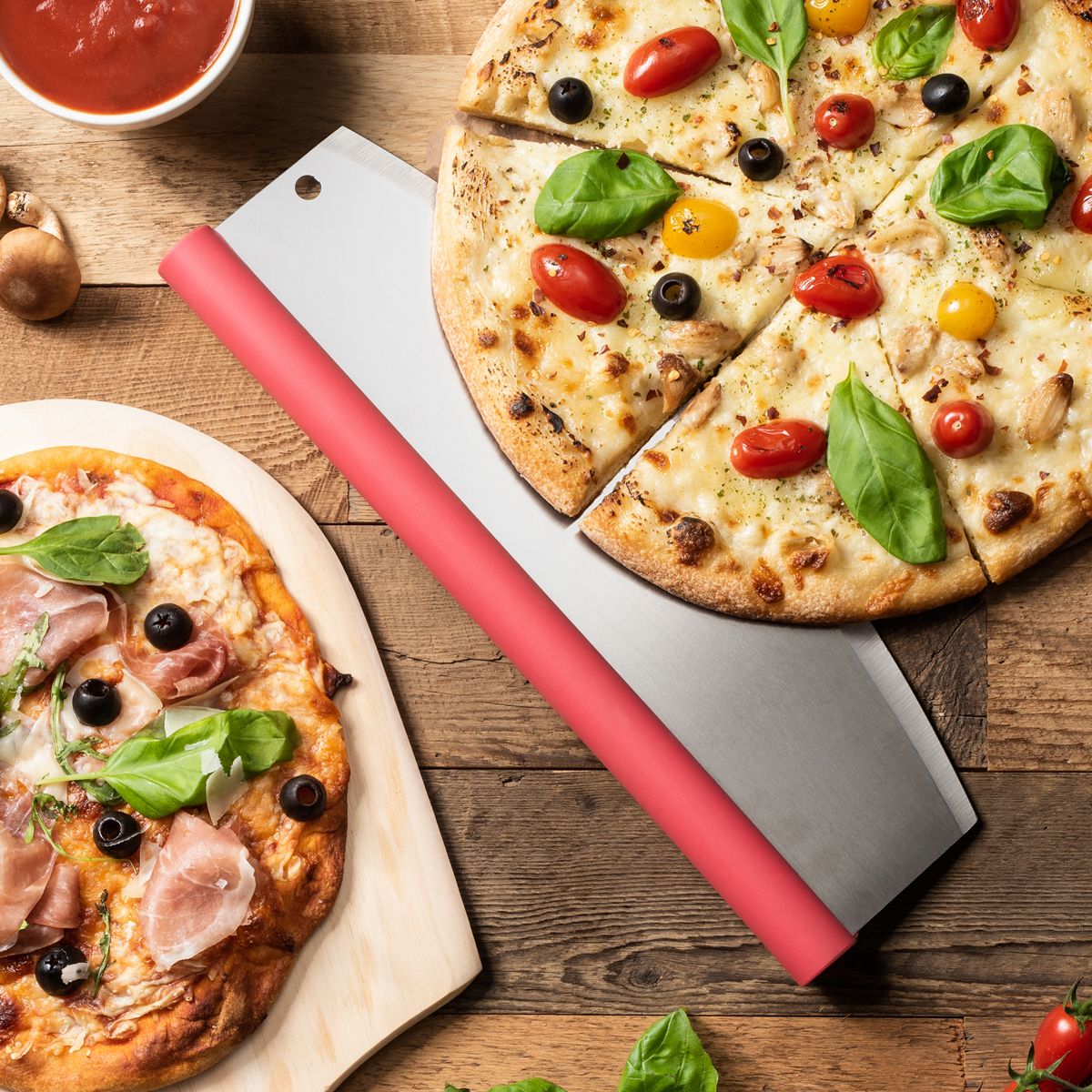 Rocking Pizza Cutter with Blade Guard under a sliced pizza on a wooden table.
