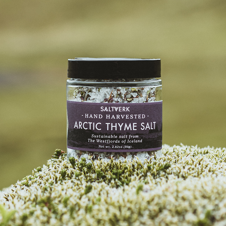 Jar of Saltverk Arctic Thyme Salt on a grassy background