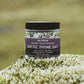 Jar of Saltverk Arctic Thyme Salt on a grassy background