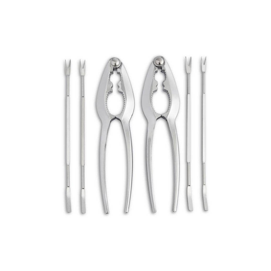 Set of metal clamshells and crackers on a white background