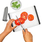 and using a knife to cut tomatoes on a white cutting board. 